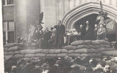 Theodore Roosevelt on platform in front of University of Idaho Administration Building.