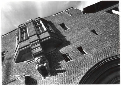 Football player gargoyle on the exterior of the Memorial Gymnasium.