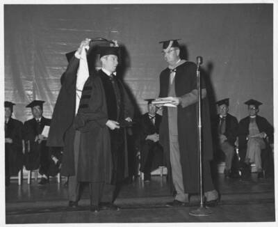 C. Foster receiving honorary degree.