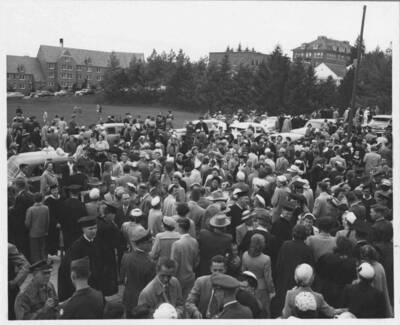 Graduates and families after graduation.