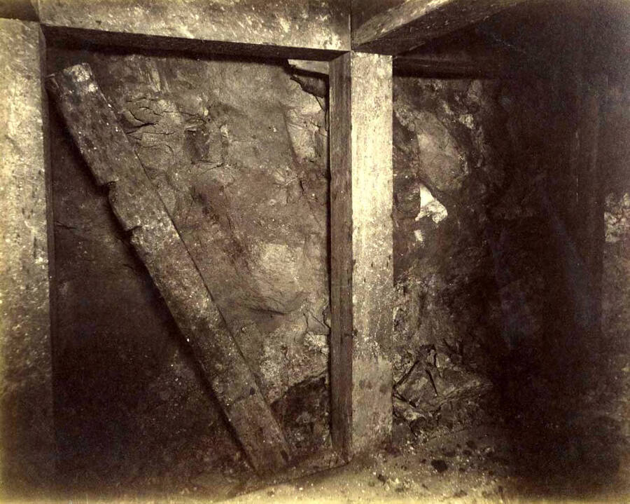 Mt Con 300 level East sill floor.  Showing ore breast closely timbered.