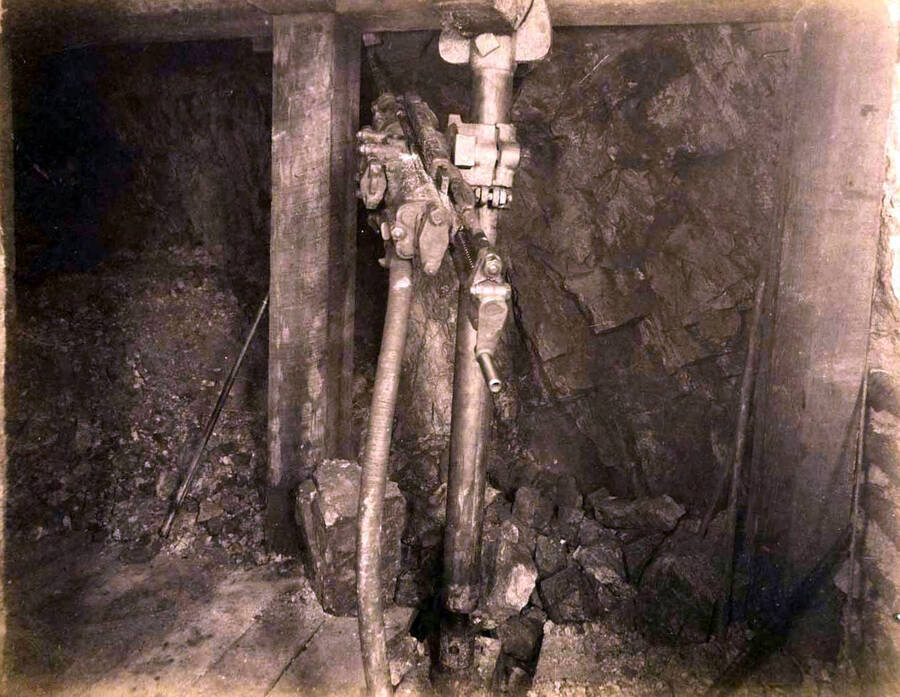 Mountain Consolidated Mine 550 level East sill floor.  Showing drilling machine drilling ore breast . Ore 45 ft.