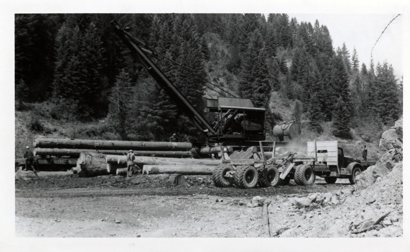 Crane loading Potlatch Forests, Incorporated logs from Stony Creek onto truck at the Merry Creek Landing, Clarkia, Idaho.
