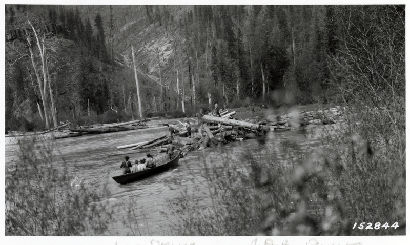 Men working on a log drive on Coeur d'Alene River. Drivers working on a center. Photo credit to the U.S.D.A. Forest Service.