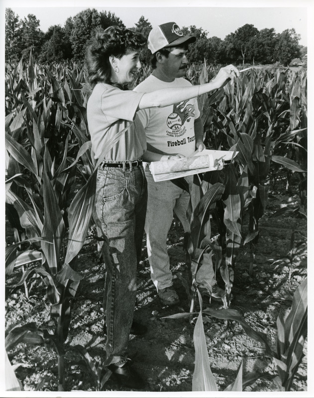 Photograph of Elesa K. Cottrell (State Conservationist, MD's first woman Resource Conservation and Development Coordinator for USDA) and James J. Green (Surveying Technician), used to illustrate an article about the USDA Soil Conservation Service in Delawaresubmitted to WiNR. photograph taken by Dot Abbott-Donnelly