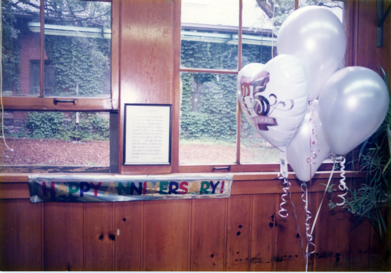 A photo of a banner that reads "Happy Anniversary!" and some balloons celebrating the Women's Center's 25th Anniversary.