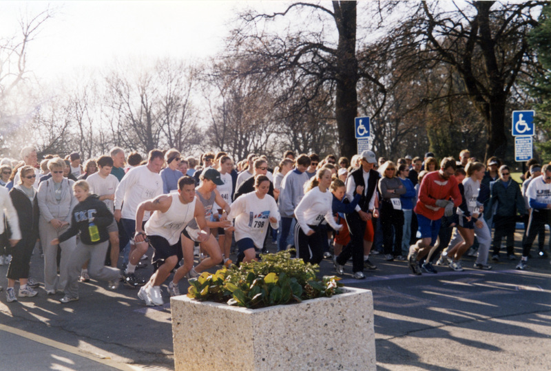 Two copies; Fun Run begins and people lined up begin running.