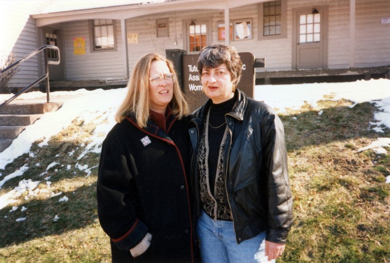 Susan Palmer and Ann Neel standing outside the Tutoring and Academic Assistance Center and Women's Center.