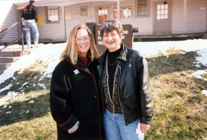Susan Palmer and Ann Neel standing outside the Tutoring and Academic Assistance Center and Women's Center.