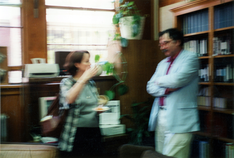 A blurry photo of an unidentified woman and man standing in the Women's Center.