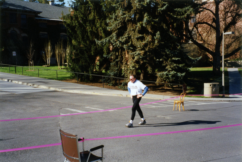 A person walking towards the finish line.