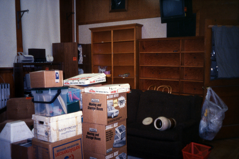 Moving boxes piled in the Women's Center. Women's Center relocation from the Old Journalism Building to the Theatre Annex, Summer 2000.