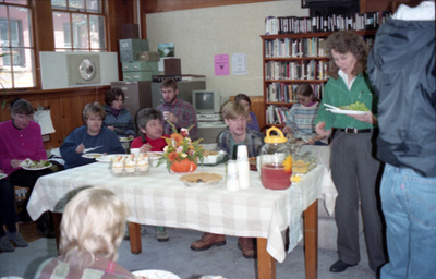 People sitting and eating food in the Women's Center [02]