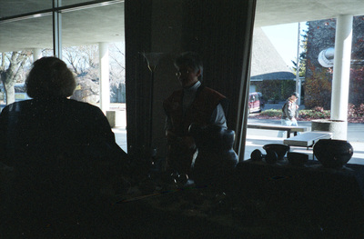 Two people standing near a booth at the first WomensWorks Arts and Crafts Fair