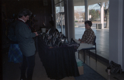 Person looking at items at a booth