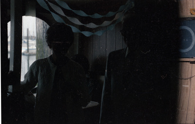 Two wedding guests pose