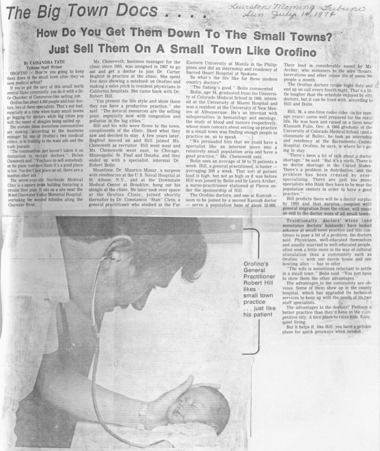 A newspaper clipping discussing how to attract doctors to small towns like Orofino. Includes a photo of General Practitioner Robert Hill with a baby.