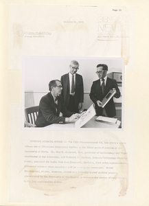 A press release and photograph showing a donation of WAMI medical books, capturing the presentation event with key figures.